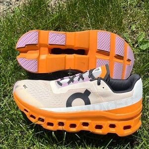 On Running Athletic Shoes in Orange and Purple